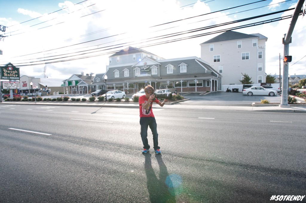 KC image and his potato gun he calls camera doing whatever it takes to get the shot, even if it means possibly dying